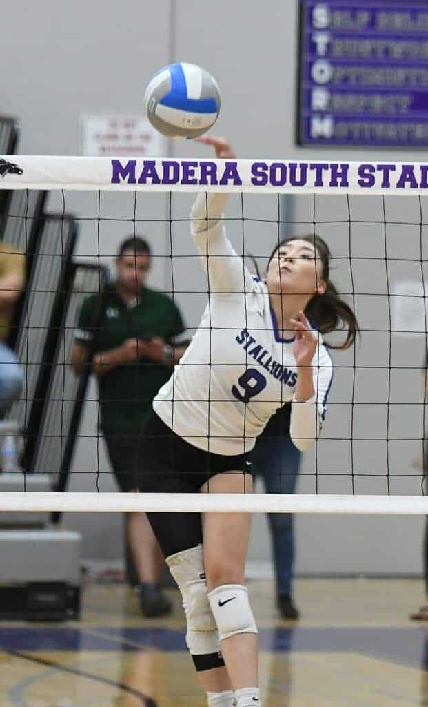Photo - Madera South’s Danae Prudente rises up to put down one of her game-high 14 kills in Tuesday’s four-set victory over Matilda Torres.