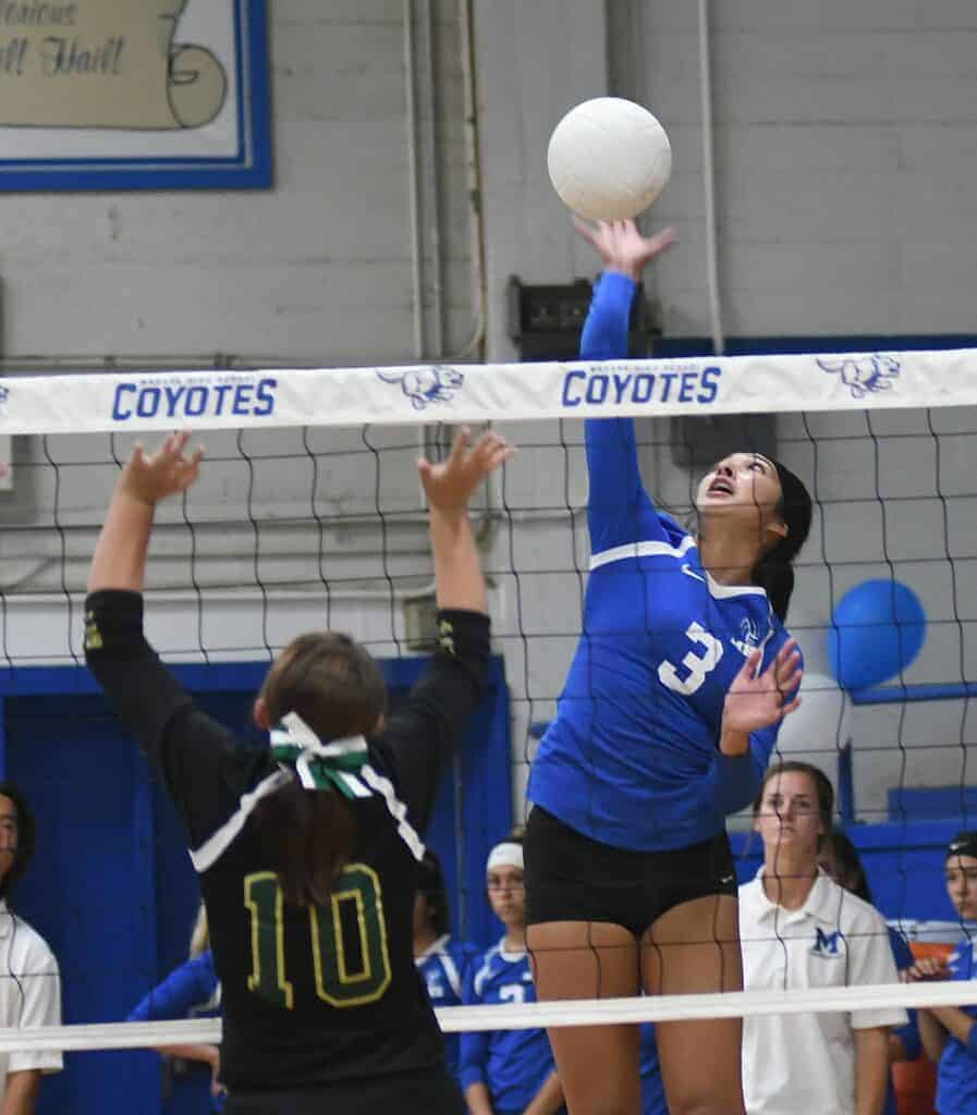 Photo - Madera’s Isabella Saucedo rises up to put down one of her game-high 20 kills in a three-set match win over Liberty.