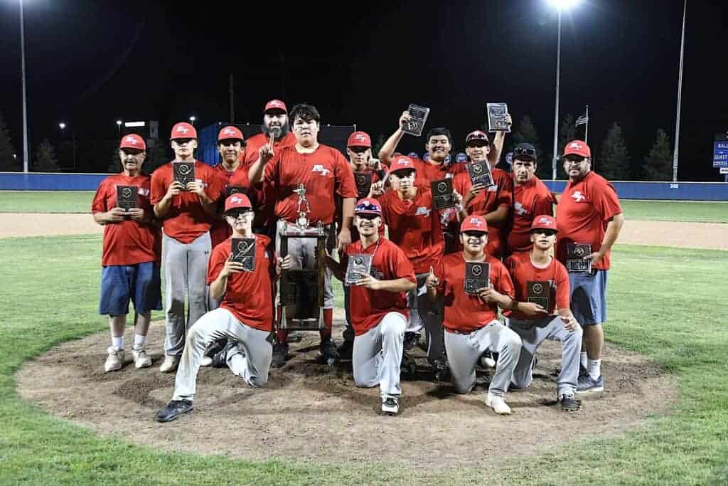 Photo - Round Table celebrates on the Mel Parker Field pitcher’s mound after winning the Madera Babe Ruth Championship with an eight-inning 2-1 victory over Breakfast Lions on Friday.
