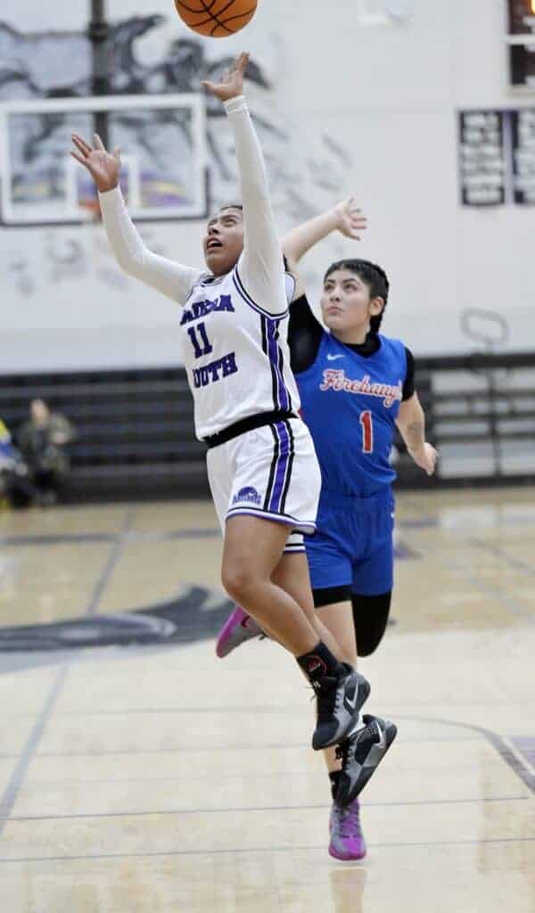 Photo - Madera South’s Mayrlin Vasquez drives in for two of her game-high 17 points in Friday’s 34-24 victory over Firebaugh. She also had seven rebounds.