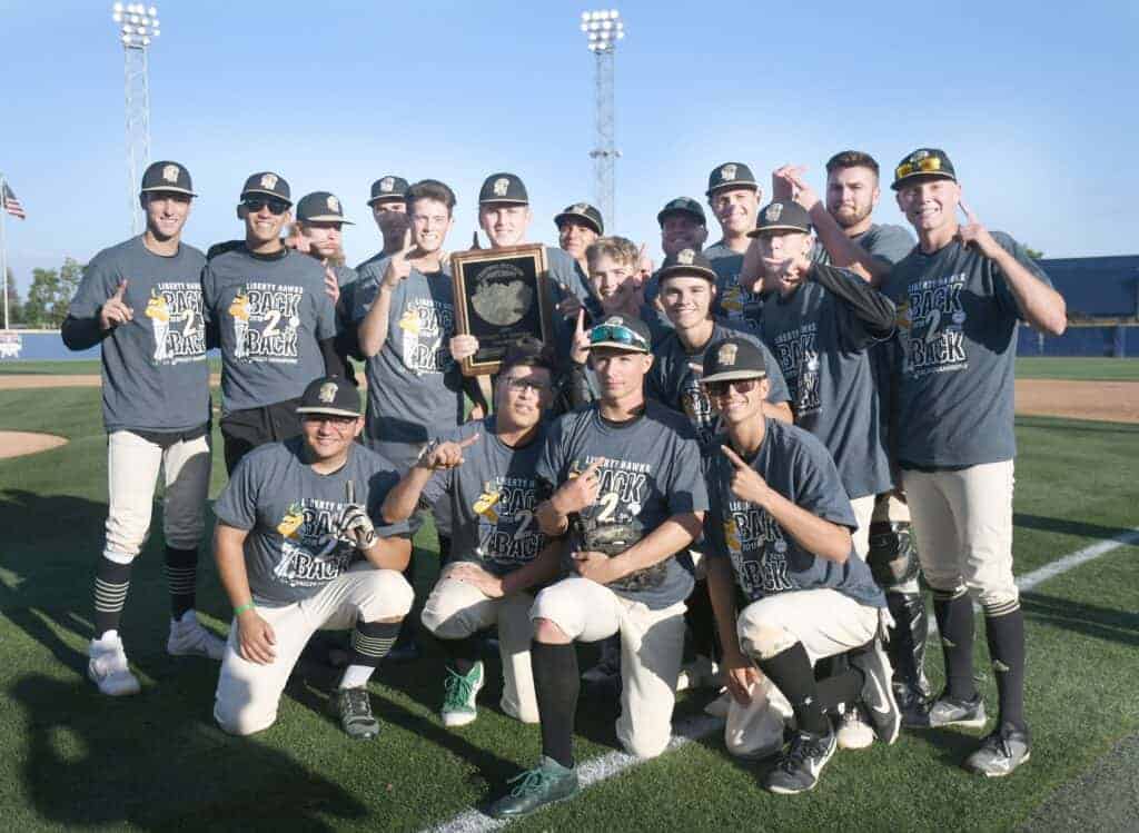 Photo - The Liberty Hawks baseball team celebrates with the Div. V Central Section champioship plaque after a 2-1 victory Friday at Fresno State’s Pete Beiden Field in Bob Bennett Stadium against the top-seeded Minarets Mustangs for its second straight Div. V title.