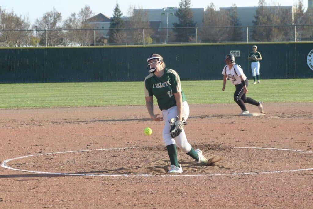 Photo - Liberty’s Sarah Shevenell throws a pitch during a victory over Golden West in February. Shevenell has committed to play softball next season at Olivet College in Michigan.