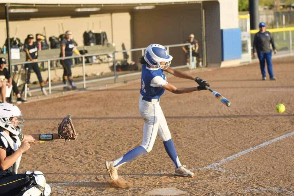 Photo - Madera’s Savana Cortez connects for a single, one of her three hits, in Friday’s 8-3 victory over Arroyo Grande to complete a doubleheader sweep.