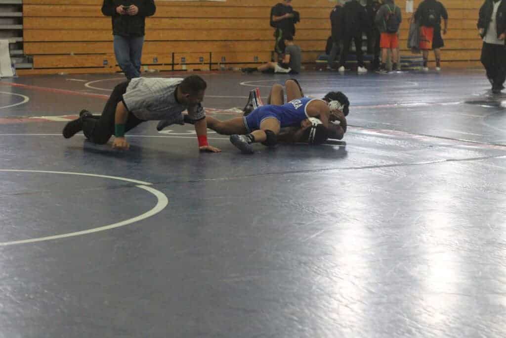 Photo - Madera’s Mario Moreno ended the Big XII Duals, hosted by the Liberty Hawks, with a pin at 120 pounds to help the Coyotes to the silver division championship Saturday at Ranchos Middle School.