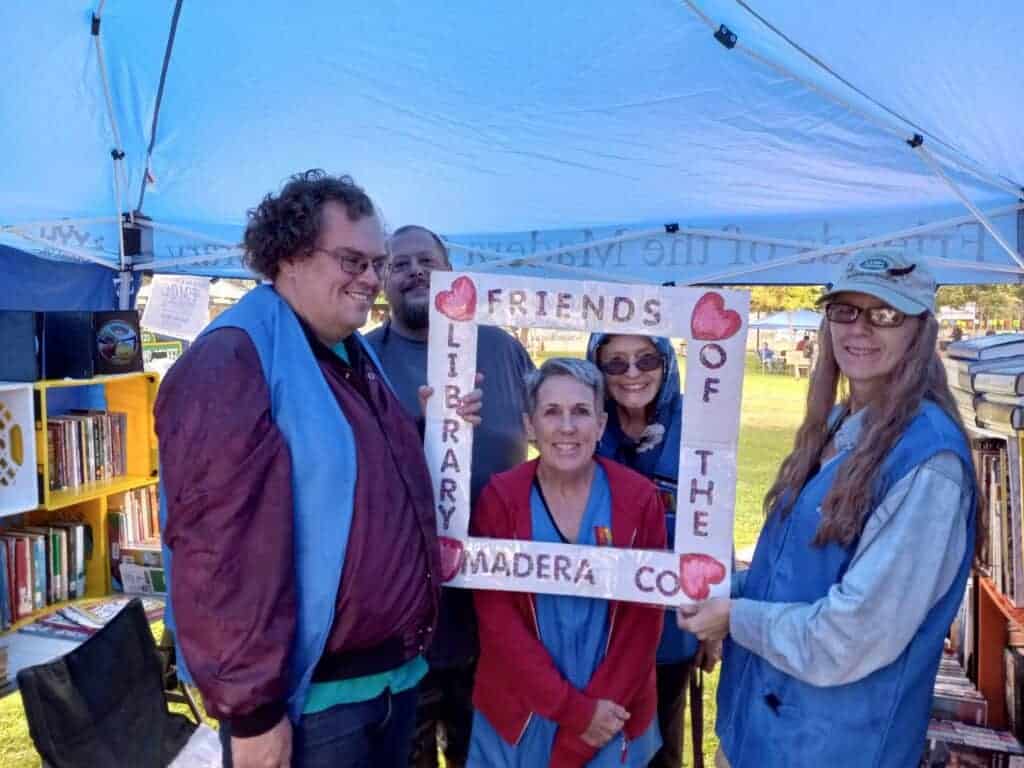 Photo - The Friends of the Madera County Library at last year’s Old Timer’s Parade, set up their canopy at Courthouse Park to sell books. From left are David Eddy, Adrian Martino, Mary Prezter, Moira Farrelly and Karen Lincoln Hartgraves.