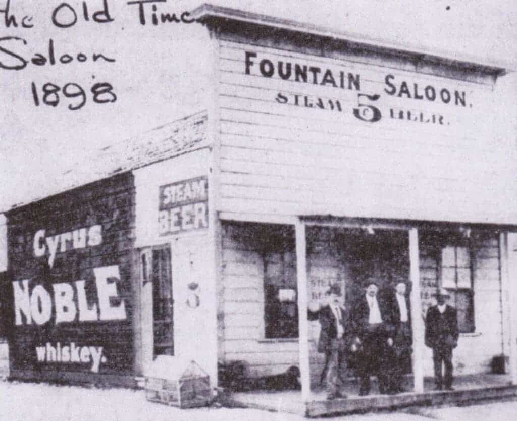 Photo - The Fountain Saloon was located at Gateway and Yosemite. George Gruber, the owner, is shown here, second from the left.