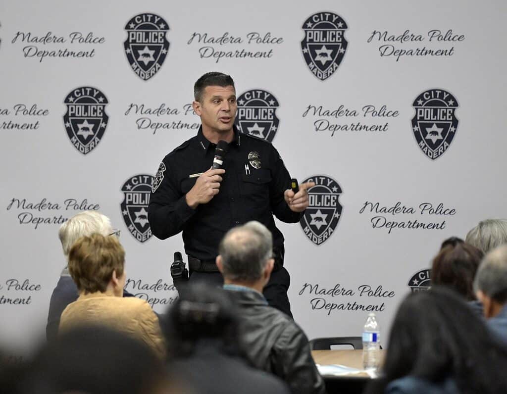 Photo - Madera Police Department Chief Gino Chiaramonte speaks to the crowd that showed up at Tuesday’s Town Hall Meeting to listen to the MPD’s annual report at Madera South High School.
