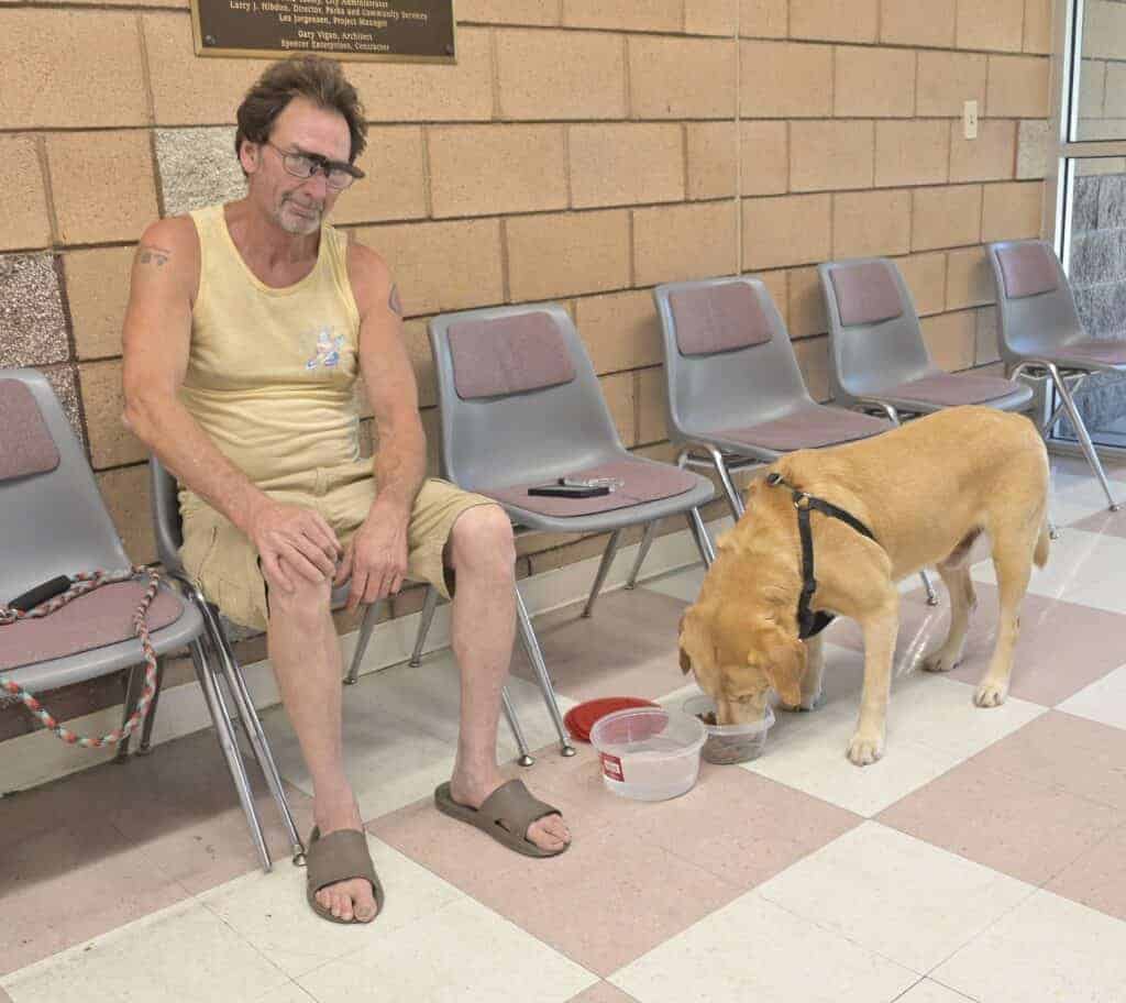Photo - Troy Parker and his dog find respite at the Pan Am Center during last year’s cooling center activations in Madera. The City of Madera will open a cooling center Thursday and Friday at the Pan American Community Center, 703 E. Sherwood Way.