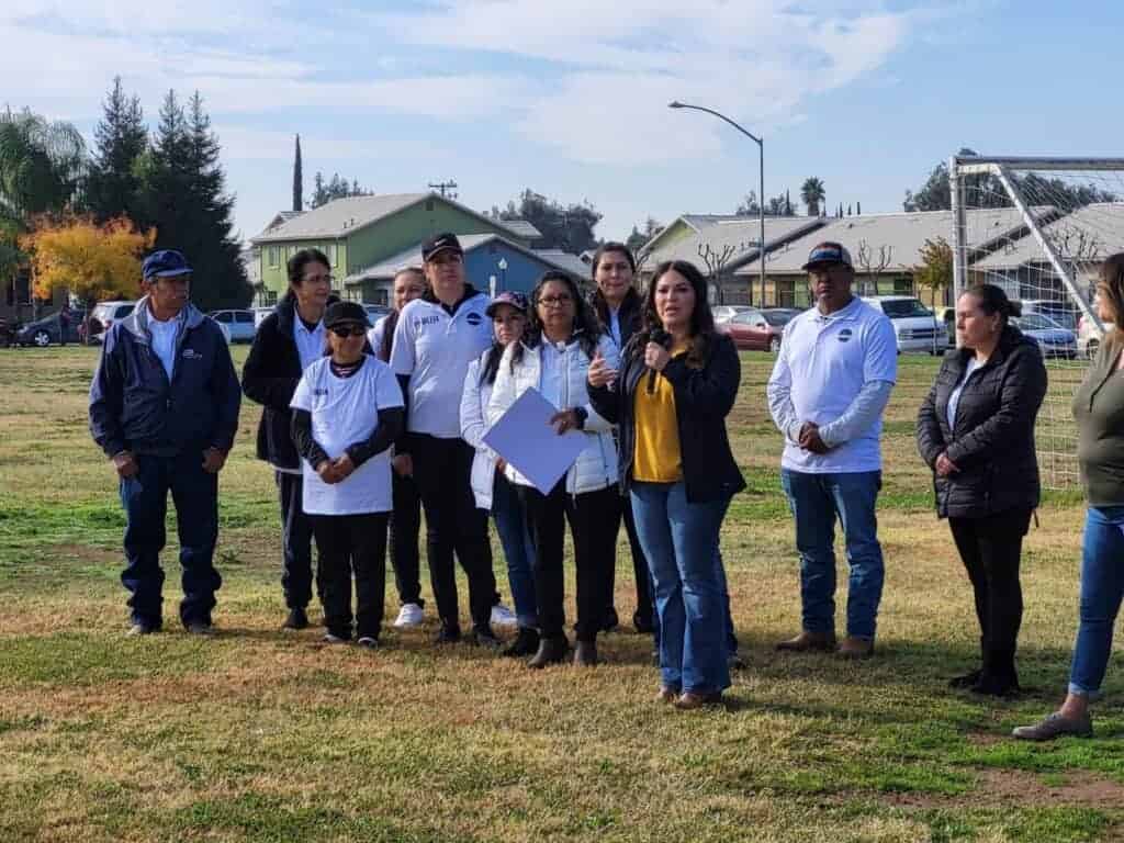 Photo - California Assemblywoman Esmeralda Soria speaks at Operation Gobble, a turkey and food giveaway event, on Monday in the Parksdale community. She helped give away 250 Thanksgiving meals to families.