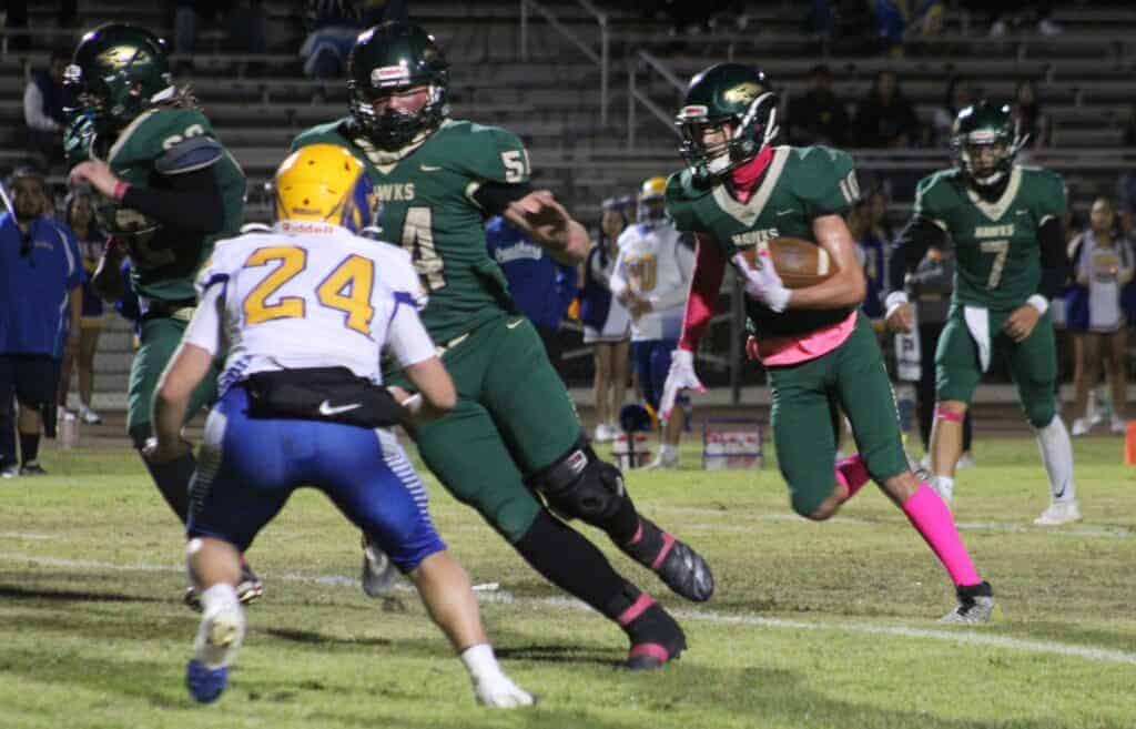 Photo - Liberty’s Jacob Rogers-Lehman turns the corner to score the first of his two long touchdown runs in Friday’s 48-8 victory over the Parlier Panthers on Homecoming.