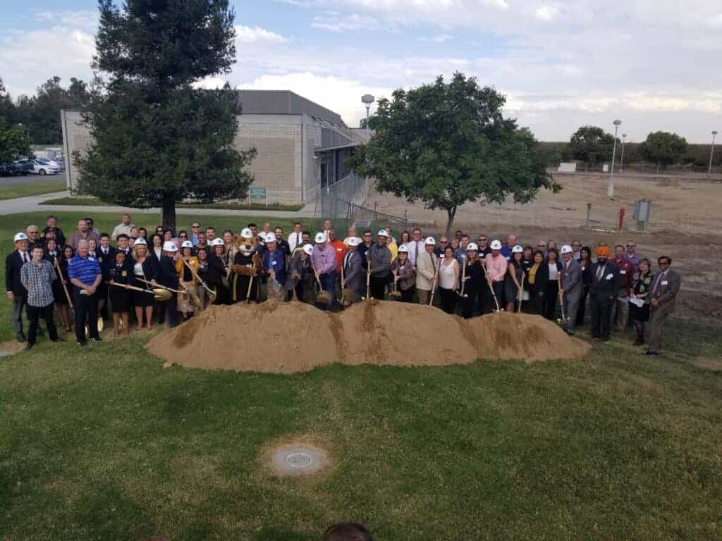 Photo - College and public officials gather at Madera Community College Center for a groundbreaking Tuesday for an expansion of the college’s agricultural facility. It is the first addition to be built with bond money from Measure C, passed by voters two years ago.