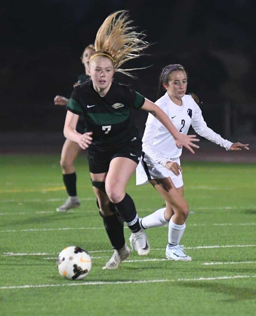 Photo - Liberty’s Zoey Richey works the ball from the defensive end to the offensive end during Thursday’s victory over Madera South.