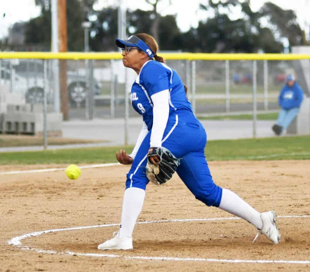 Photo - Madera’s Kaylee Dawson pitches the Coyotes to a 2-0 victory Thursday over Clovis West in the season opener for both teams.