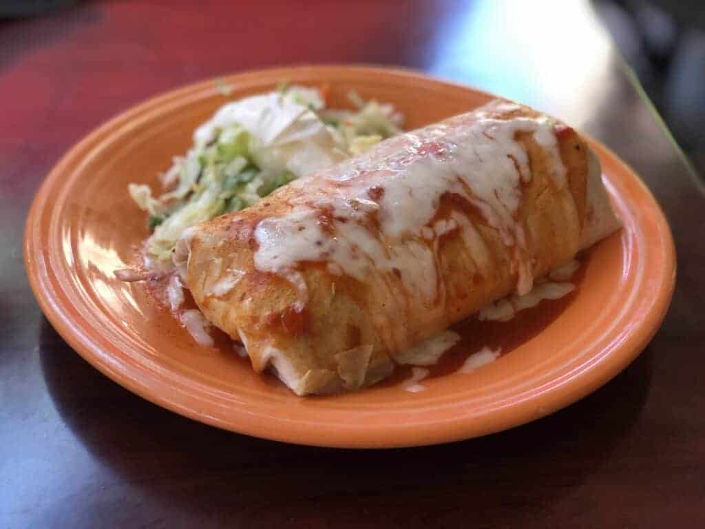 Photo - Sit down to a hearty meal of a smothered beef burrito.