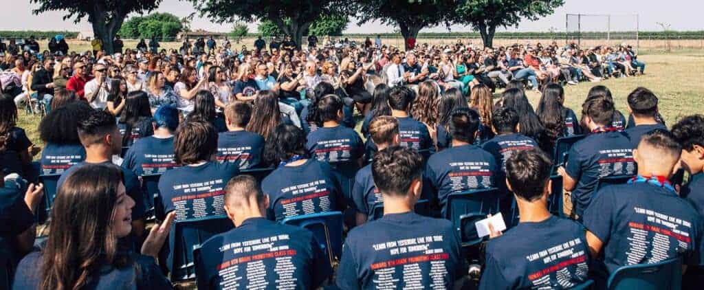 Photo - Howard Elementary School students and staff applaud during the opening of the 2023 graduation ceremony on June 8.