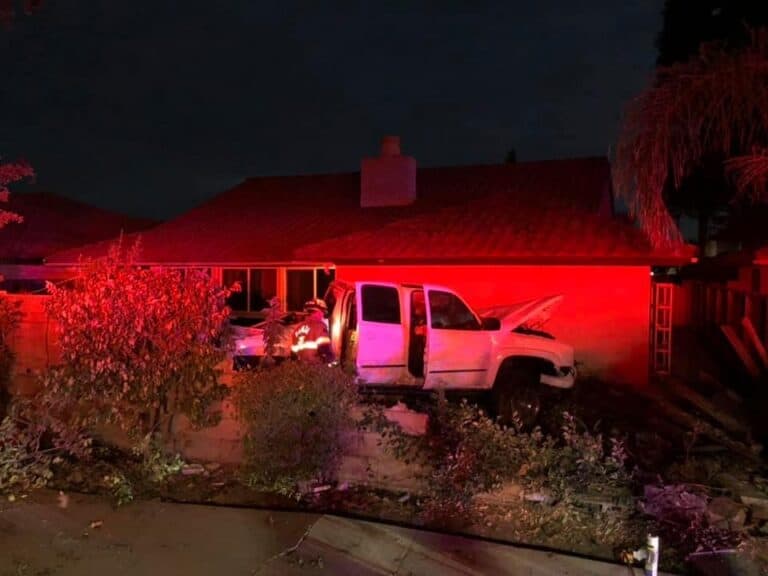 Truck startles family in backyard crash