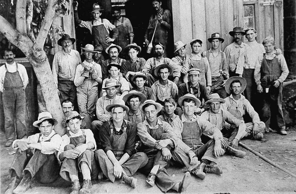 Historic black-and-white photo of early 20th-century workers in Madera, California.