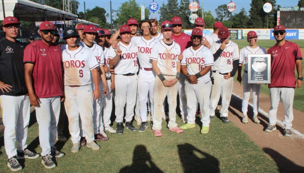 Madera Toros baseball team poses after a game at the field.