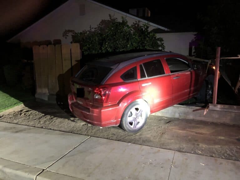 Driver crashes into house, detained for alleged DUI