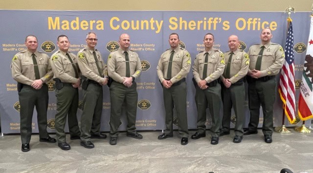 Madera County Sheriff's Office officers standing together in uniform.