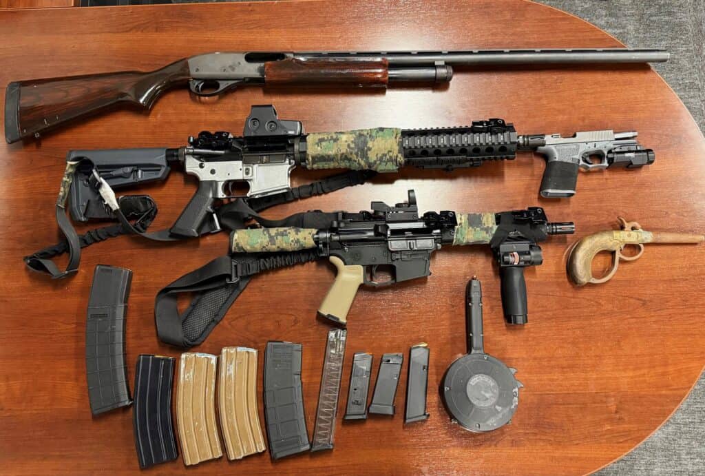 Photo of The Madera Police Department displays the guns and ammunition seized during an arrest Wednesday afternoon.