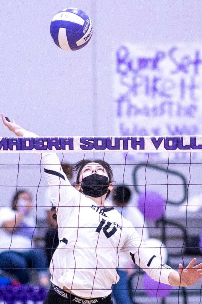 Volleyball player in action during a match at Madera South High School.