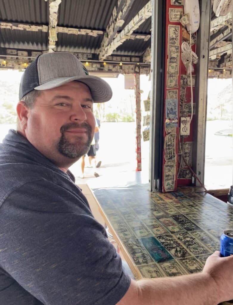 Man enjoying a drink at a local Madera Tribune café.