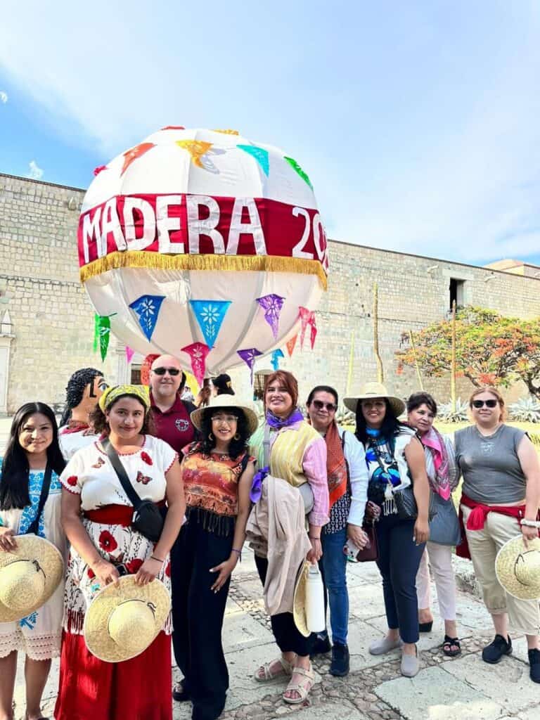 Group of people celebrating Madera's 250th anniversary with a colorful hot air balloon.