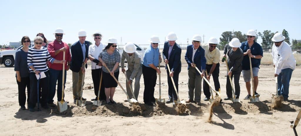 Group of officials and community members at groundbreaking event in Madera County.