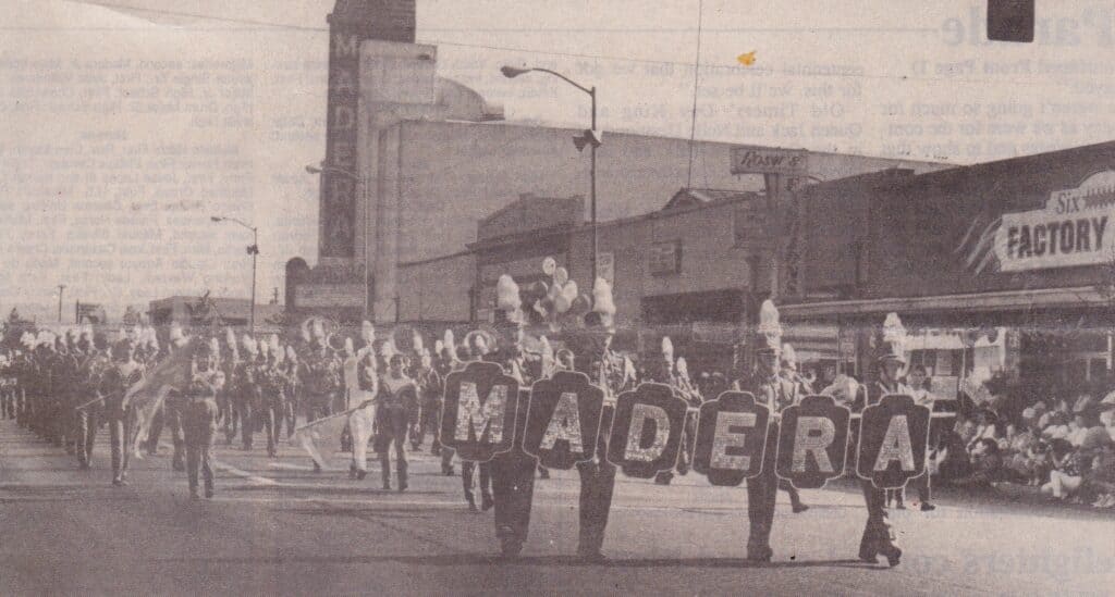 Madera parade with participants holding "MADERA" letters in downtown Madera.