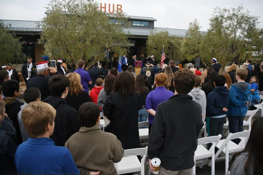 Community gathering at Madera HUB with diverse crowd and speakers.