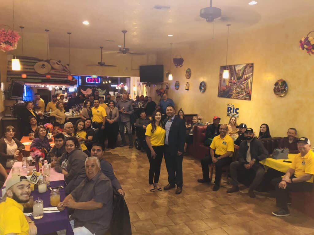 Community gathering at Madera Tribune event in restaurant.