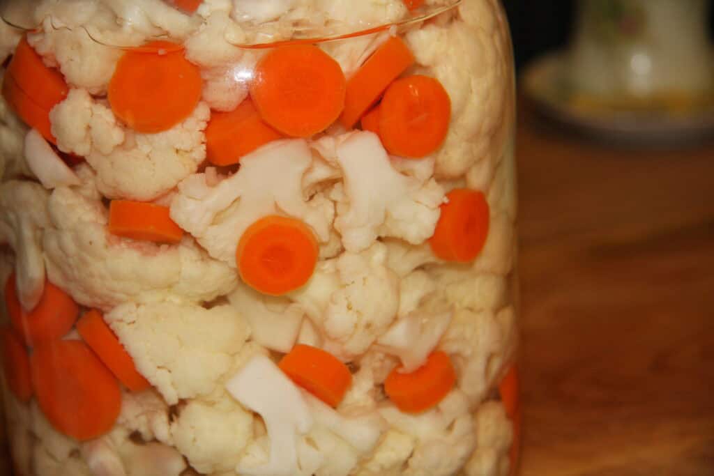 Photo of A big jar of refrigerated, crispy pickled cauliflower and carrots is an irresistible snack.