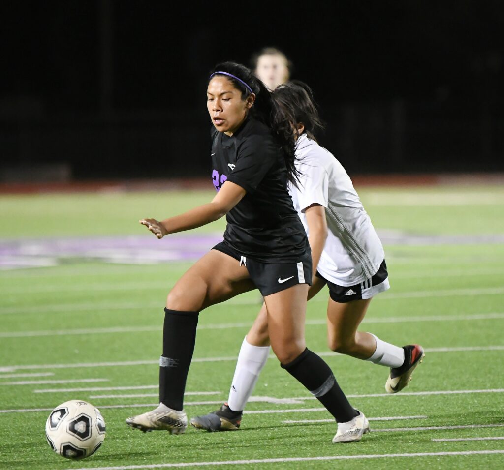 Photo - Madera South’s Emily Santos works the ball for the Stallions during a 4-0 win Tuesday in the Div. III first round playoffs.