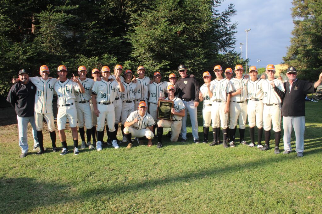 Photo - The Liberty Hawks baseball team celebrates its first Valley Championship since 2009 after Friday’s 4-2 victory over the Arvin Bears in the Div. V Valley Championship game in Rawhide Stadium in Visalia