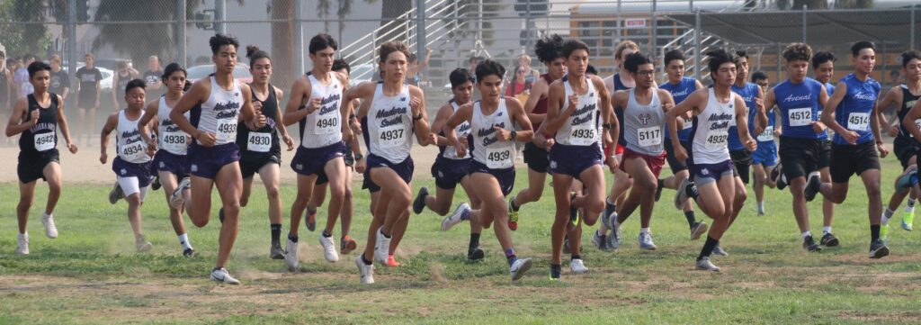 Photo - The Madera South junior boys cross country team members take off to begin the DeWitt Invitataional. The Stallions won the race and placed second overall.