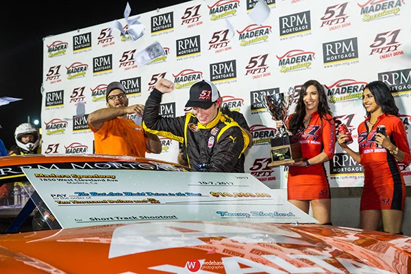 Photo - Buddy Shepherd climbs out of his car to celebrate winning the $10,000 Short Track Shootout on Saturday.