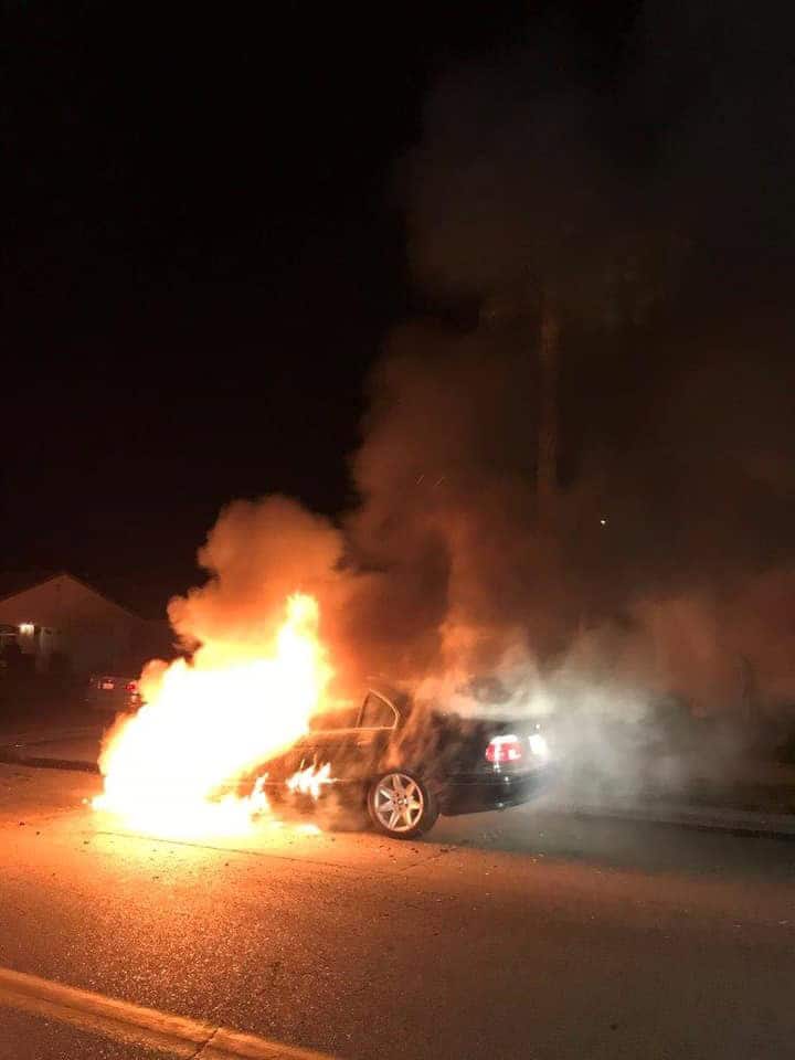 Car engulfed in flames during night in Madera, California.