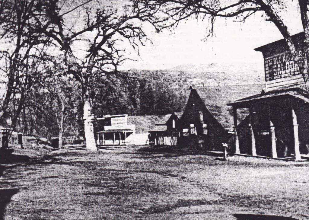Historic Main Street in Madera with old buildings and trees.