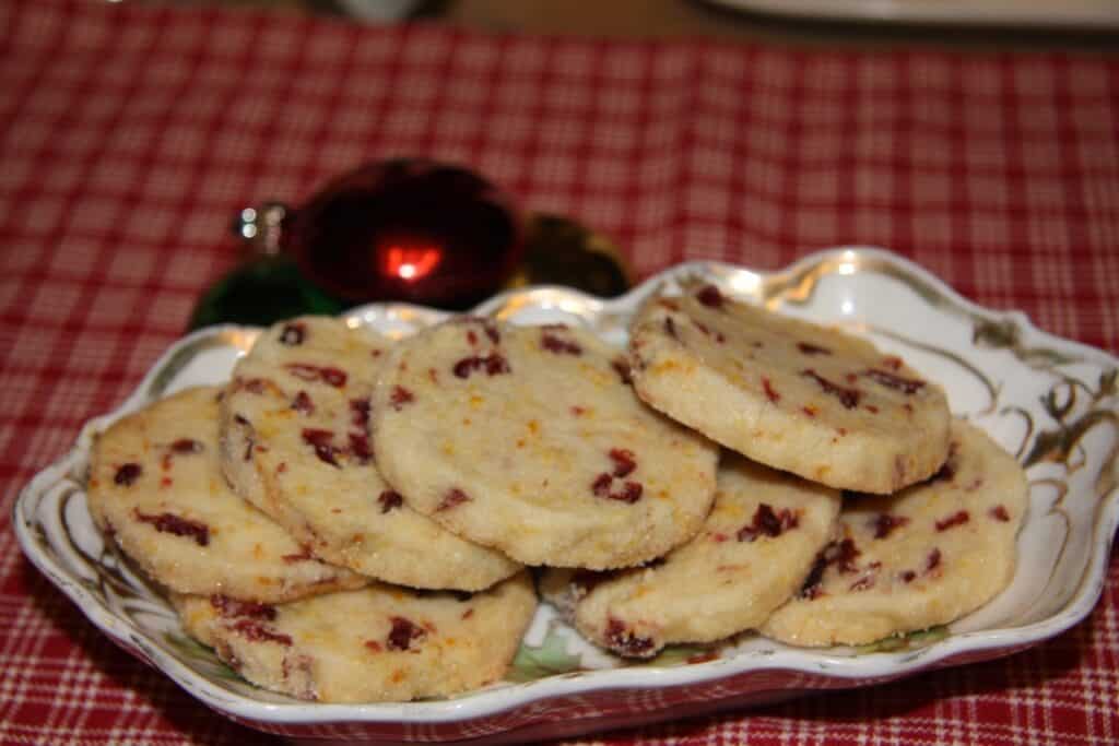 Cranberry cookies on a decorative plate with a festive background.