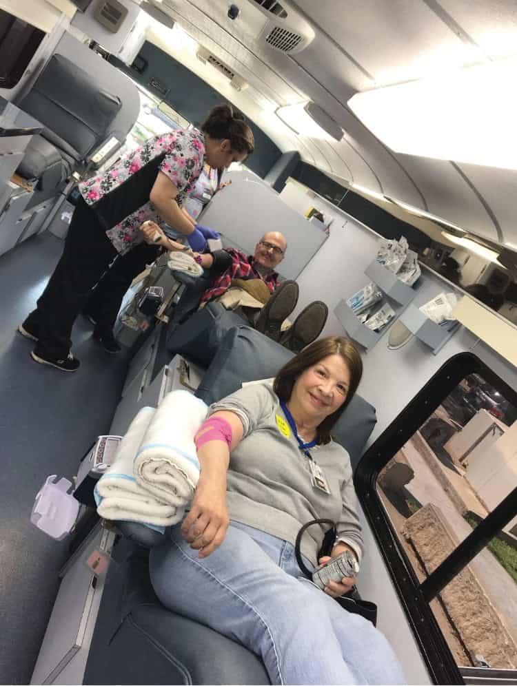 Blood donation in airplane medical cabin.