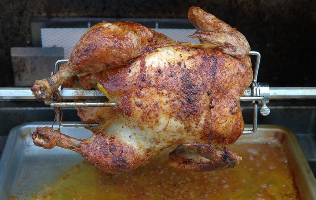 Rotisserie roasted chicken with crispy skin and juicy meat.