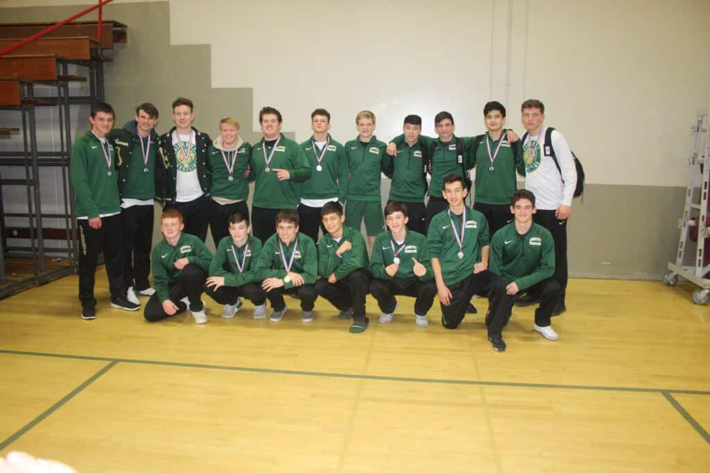 Madera High School basketball team with medals after a game.