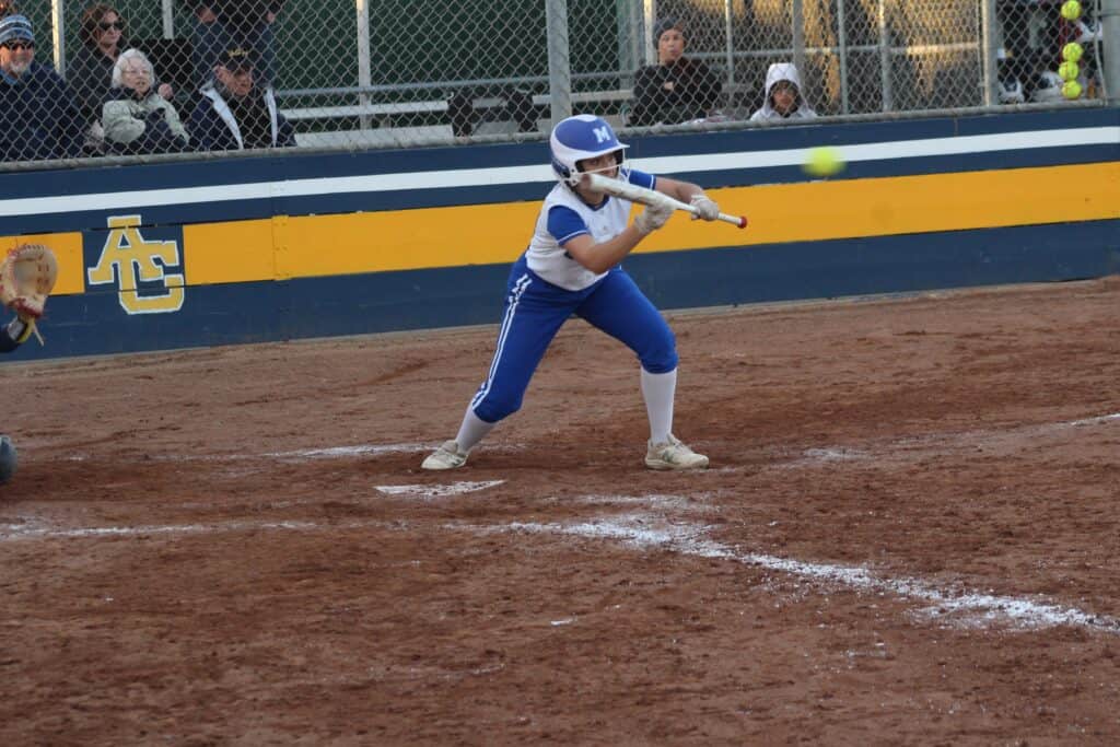Youth baseball player at bat during a game at Madera field.