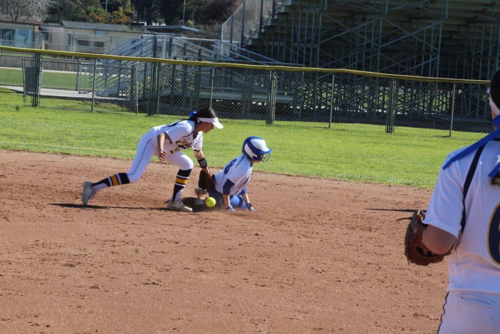 Young baseball players in action on the field during a game.