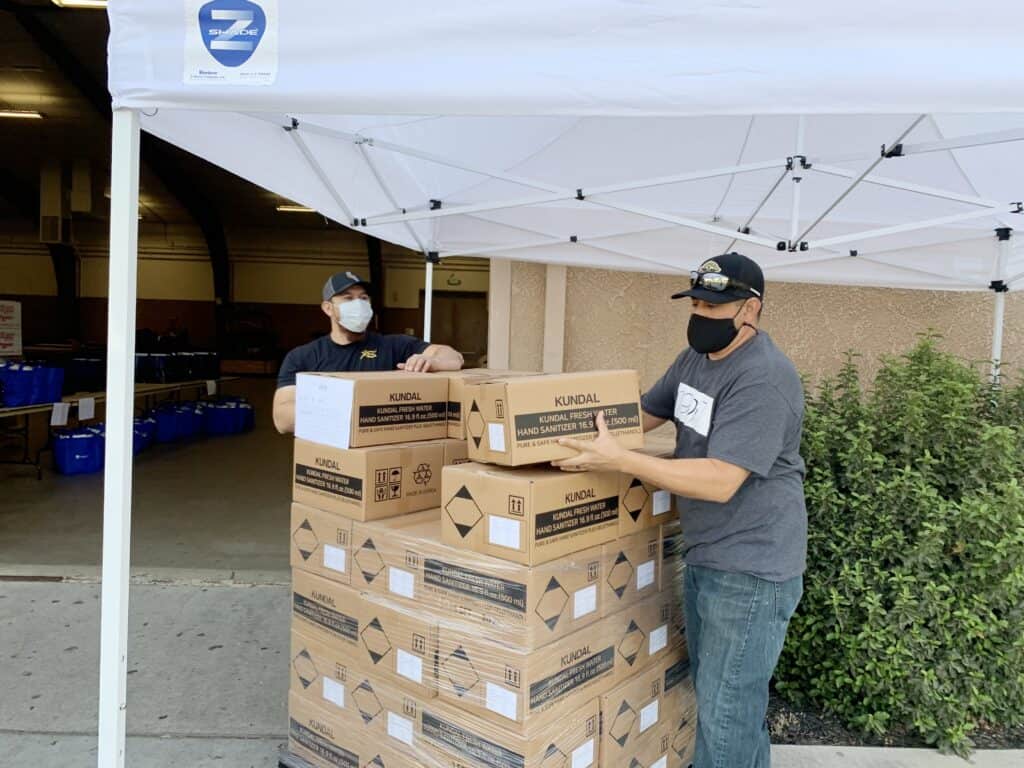 Volunteers packing boxes at a community event in Madera.