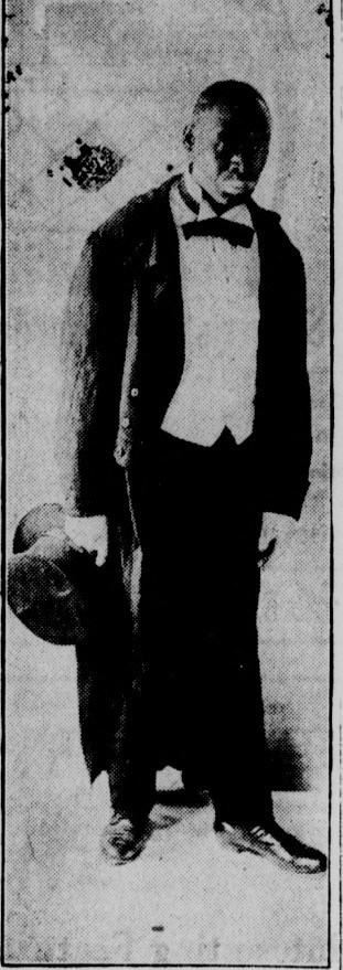 Vintage photo of a young man in formal attire from the Madera Tribune archives.
