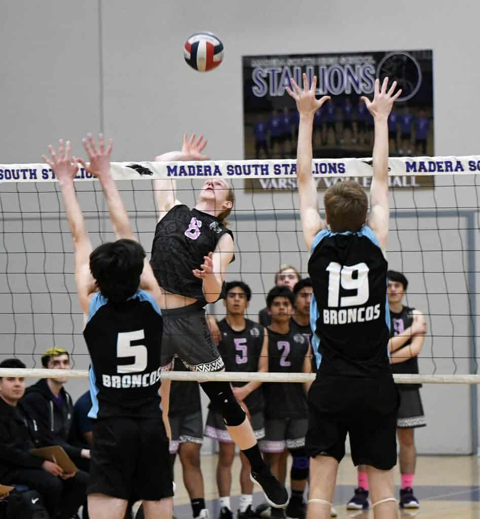 Girls volleyball game at Madera South High School gymnasium.