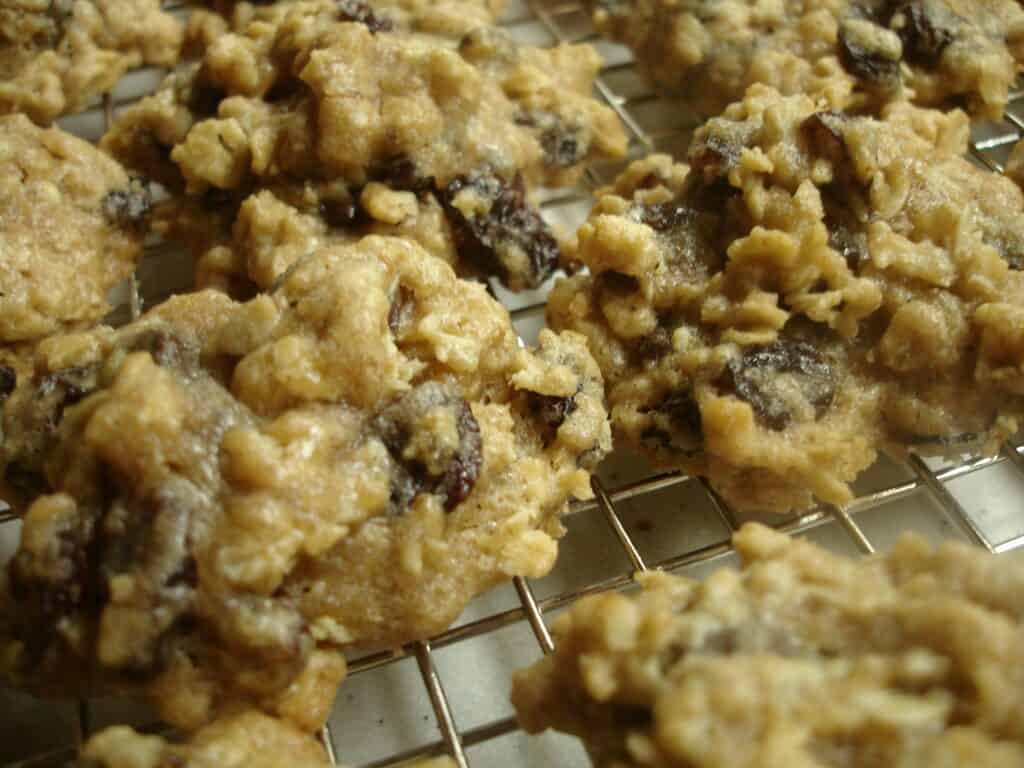 Chocolate chip cookies cooling on a wire rack.