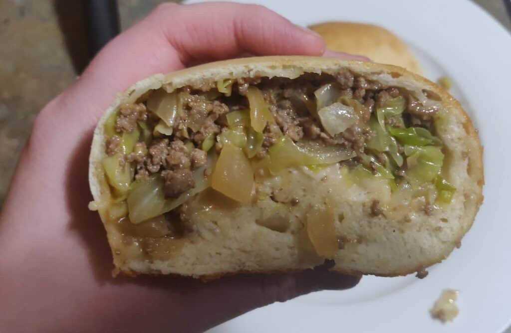 Beef and vegetable-filled pastry, freshly baked and ready to enjoy.